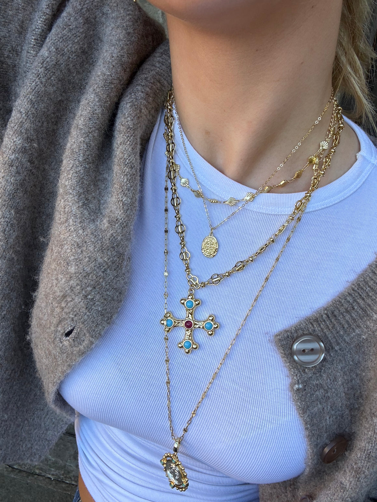 Chunky gold necklace with cross charm for statement jewellery look
