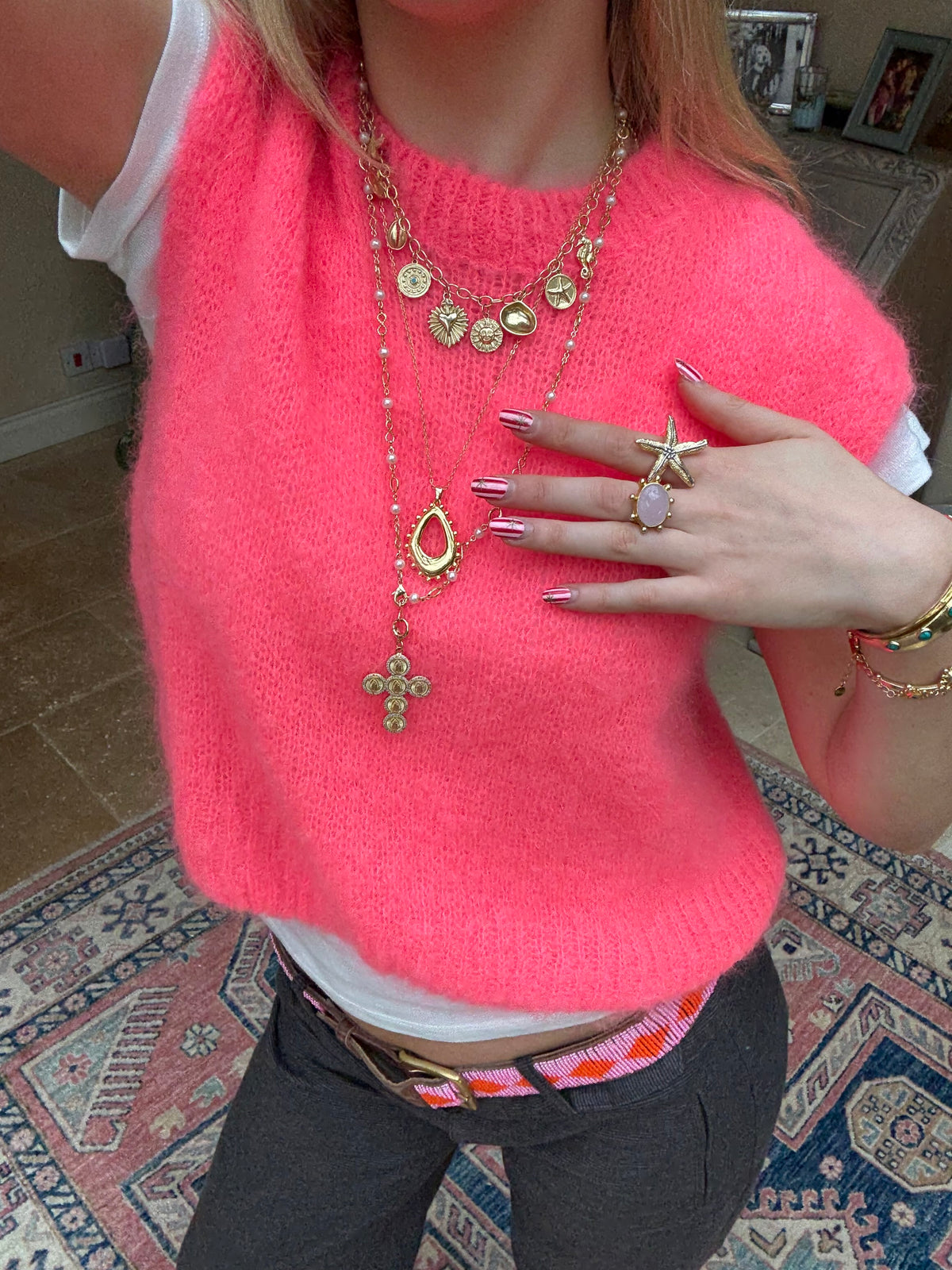 Layered gold necklaces styled for a cool jewellery stack