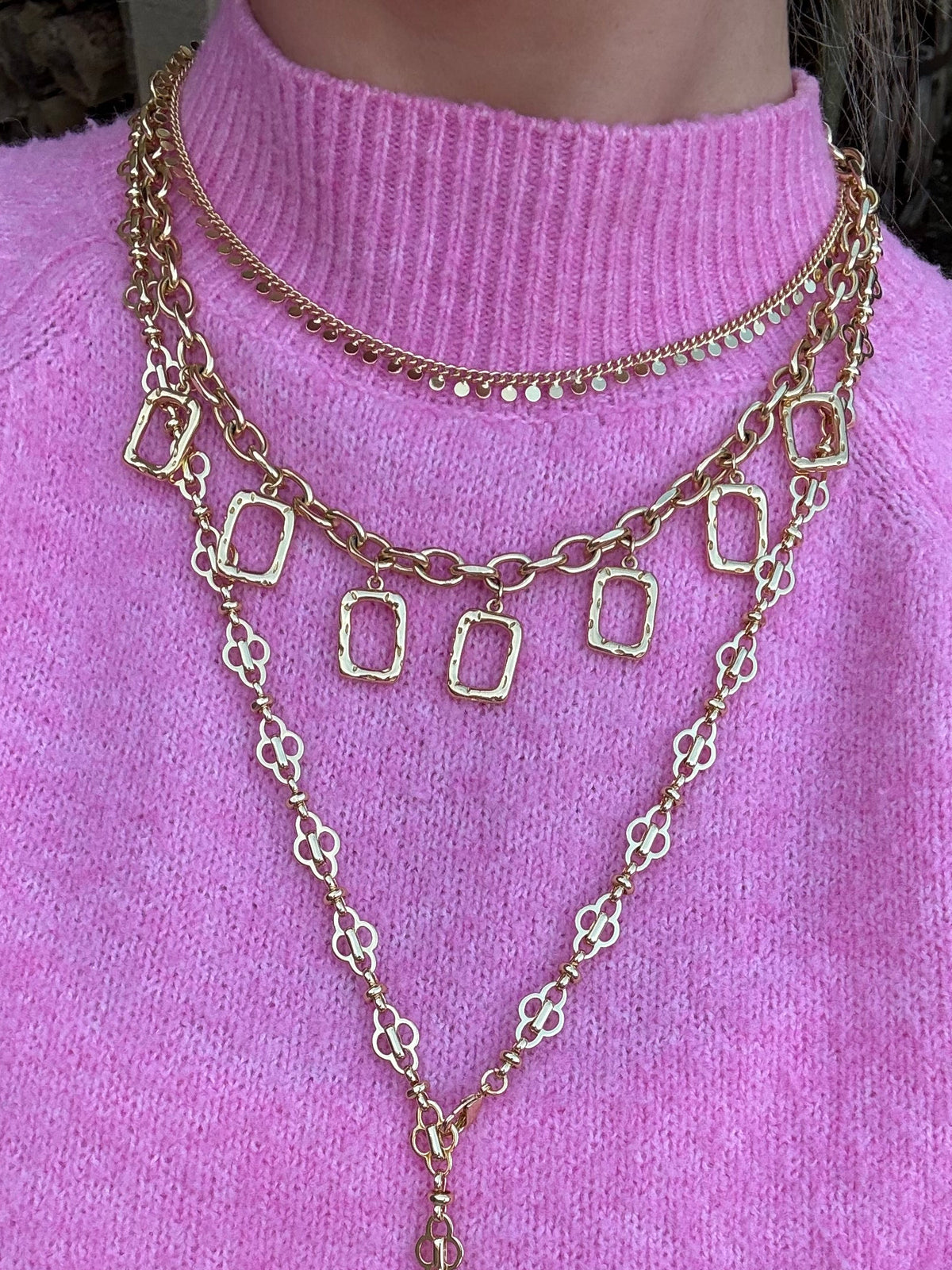 Layered gold necklaces styled for everyday jewellery stack